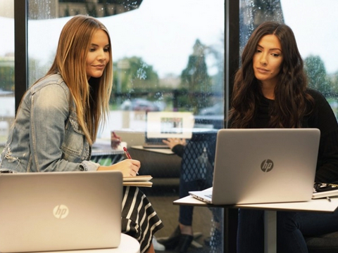 Tweezerman Team members working at desks.