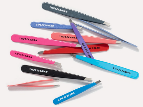 Multicolored Tweezerman tweezers assortment - showcasing their ability to be sharpened to last a lifetime.