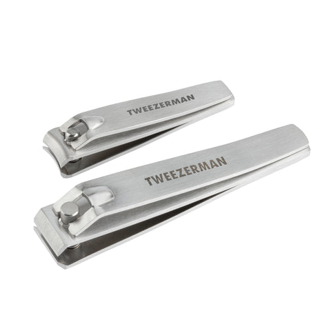 Stainless steel fingernail clipper next to stainless steel toenail clipper