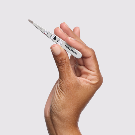 Model holding Disney's 101 Dalmatians Slant Tweezer