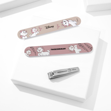 Disney's The Aristocats Nail Files and Disney's Ear-esistible Fingernail Clipper placed on a white block tray
