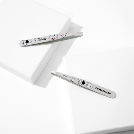 Disney's 101 Dalmatians Slant Tweezer placed on a white block tray