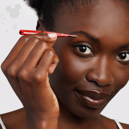 Model using Disney's Mickey Mouse &amp; Minnie Mouse Magic All Around Petite Point Tweezer