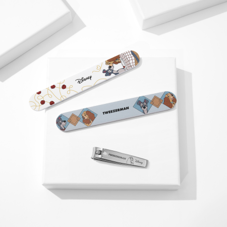 Disney's Lady and the Tramp Manicure Kit featuring Nail Files and Disney's Ear-esistible Fingernail Clipper placed on a white block tray