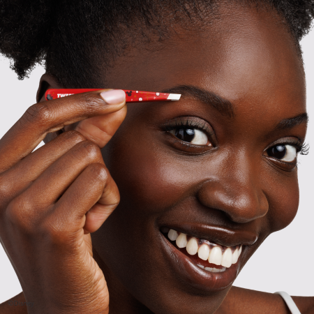 Model using Disney's Mickey Mouse & Minnie Mouse Magic All Around Petite Slant Tweezer