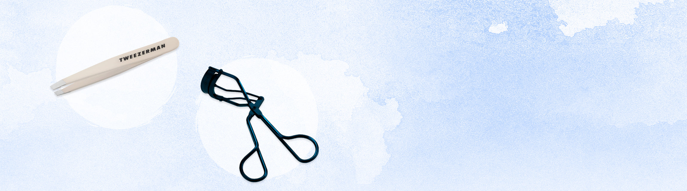 NUDE MINI SLANT TWEEZER AND NAVY EYELASH CURLER, IN WHITE AND BLUE BACKDROP