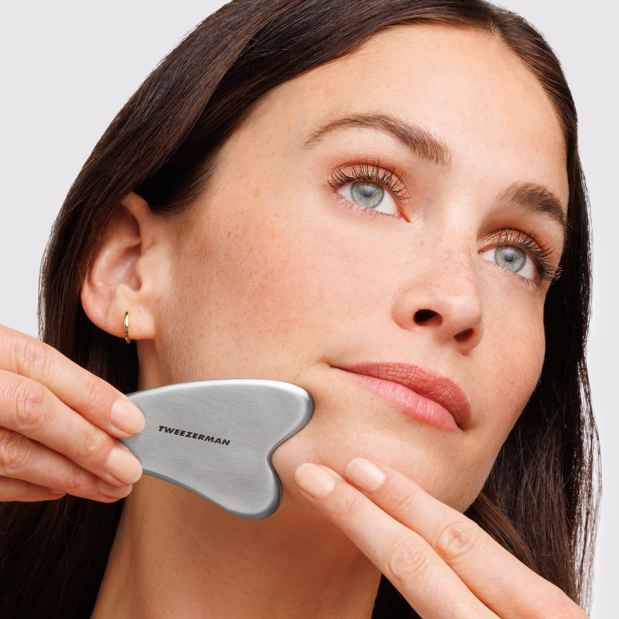 Model using Stainless Steel Gua Sha