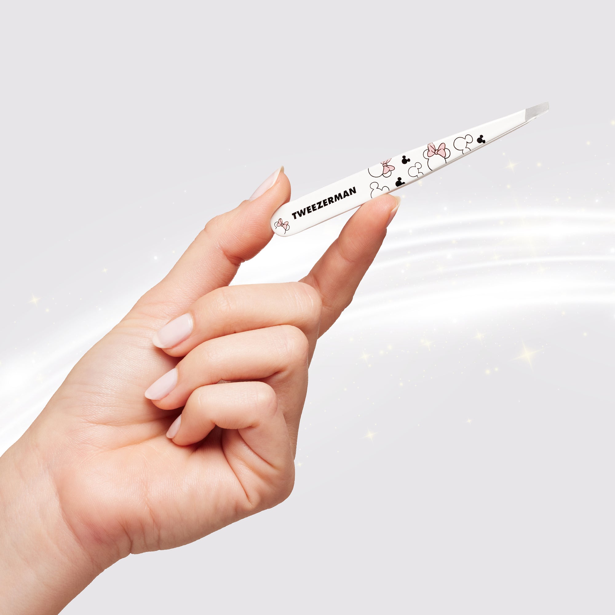 Model holding Ear-esistible Slant Tweezer