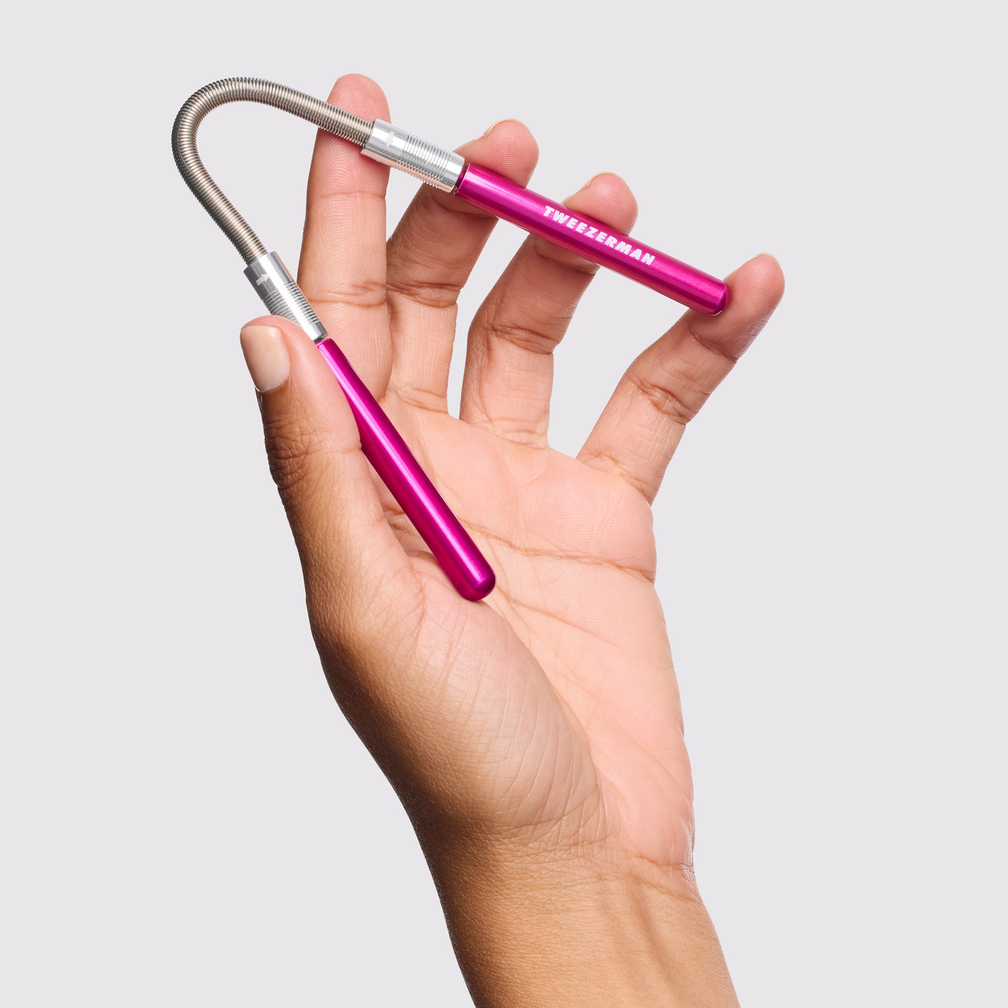 Model holding Facial Hair Remover