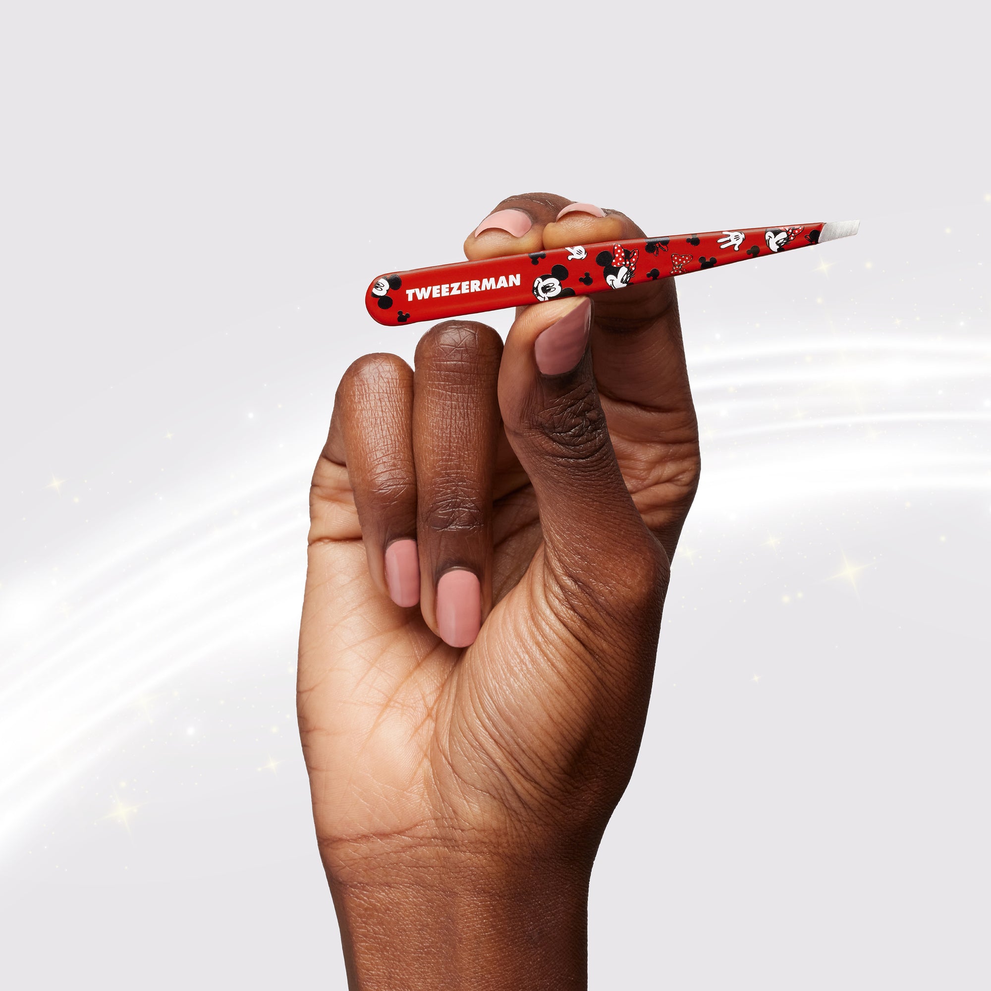 Model holding Red Mickey Mouse and Minnie Mouse slant tweezer with red bow and white hands