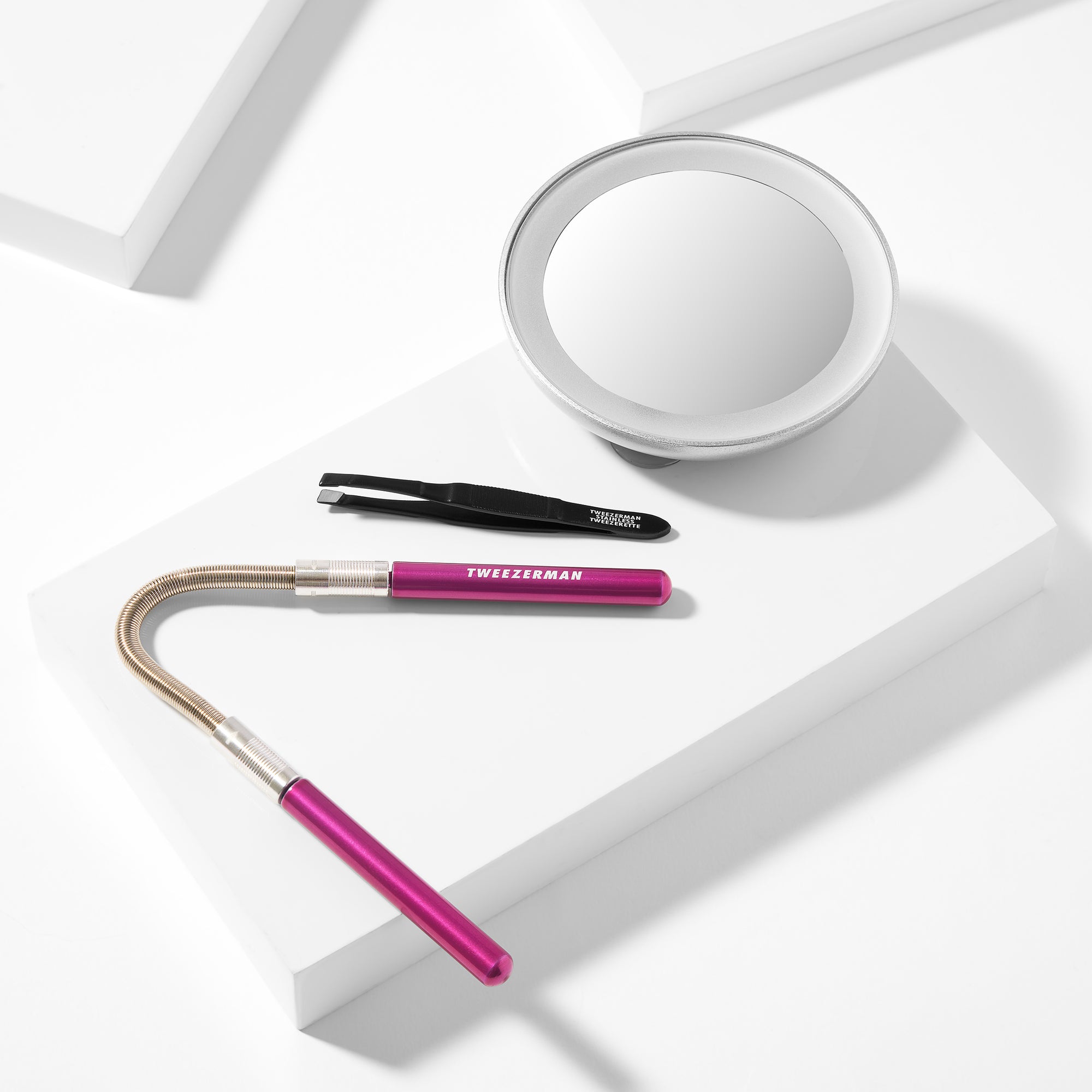 Facial Hair Remover + Mirror Set placed on a white block tray