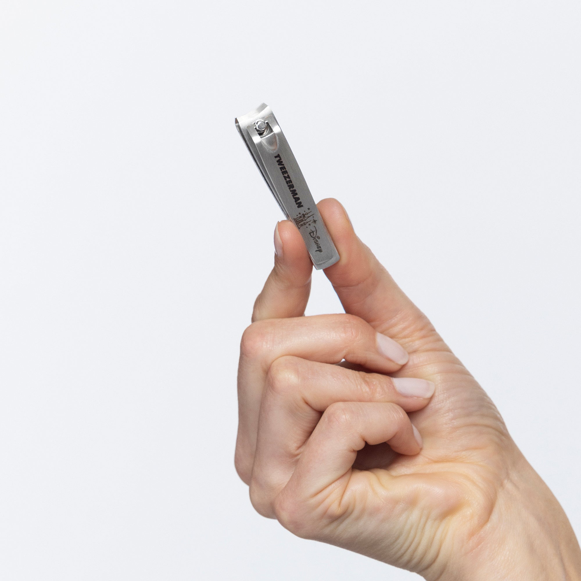 Model holding Disney&#39;s Happily Fingernail Clipper