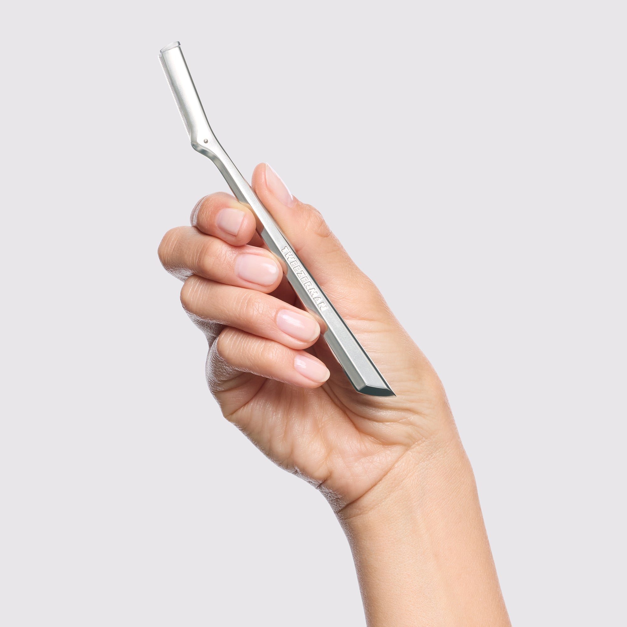 Model holding Facial Razor