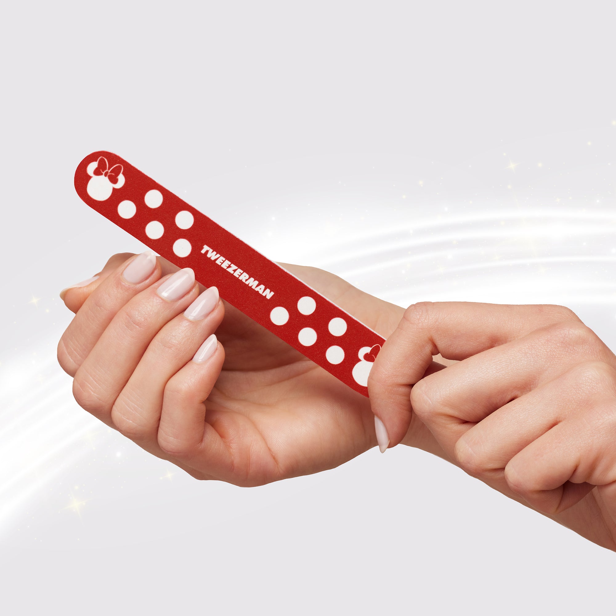 Model using red Mickey and Minnie Mouse Nail File