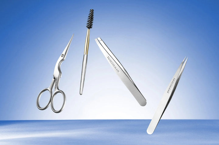 Set of eyebrow grooming tools including scissors, brush, and tweezers on a blue background