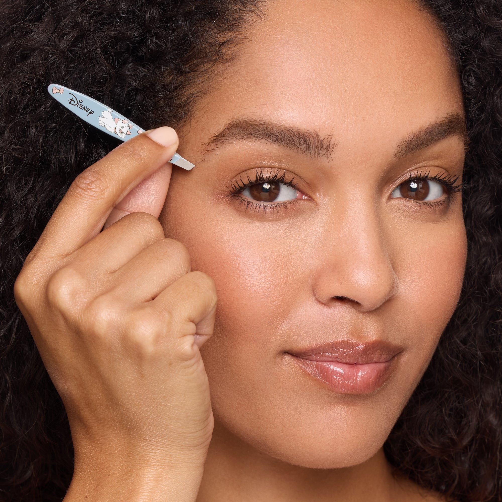 Model using Disney&#39;s The Aristocats Mini Slant Tweezer
