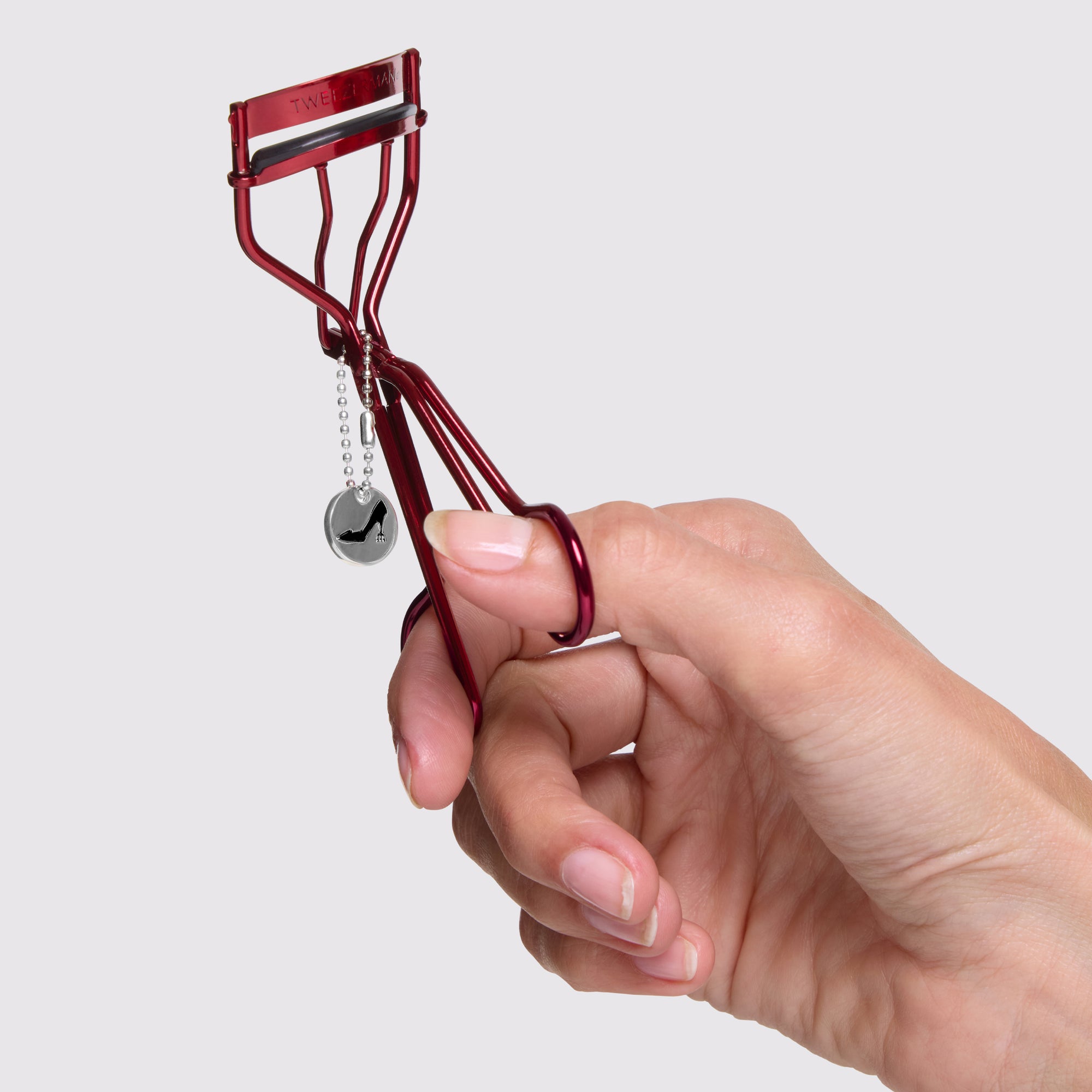 Model holding The Devil Wears Prada 2 Curler