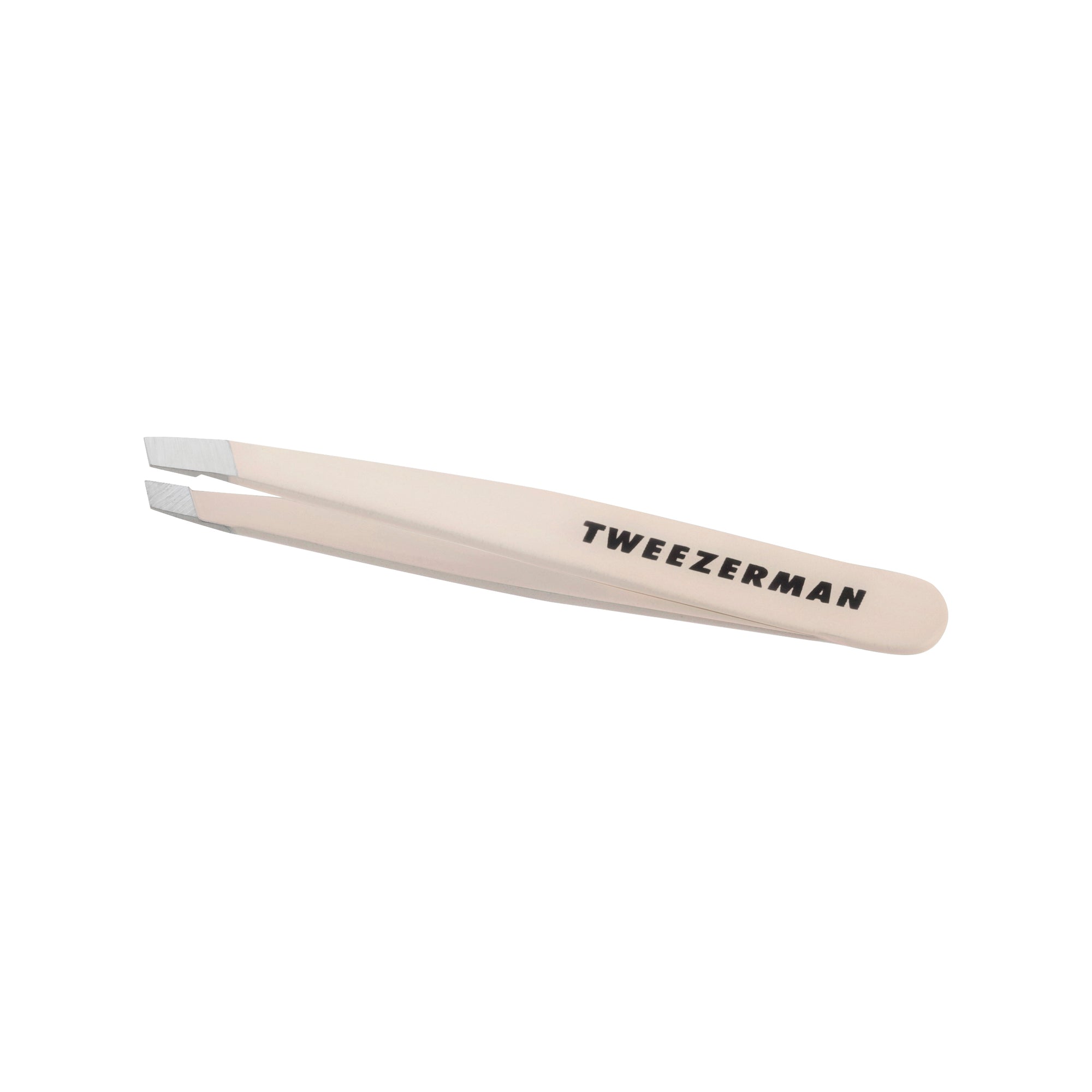 Nude Mini Slant Tweezer with black Tweezerman logo.