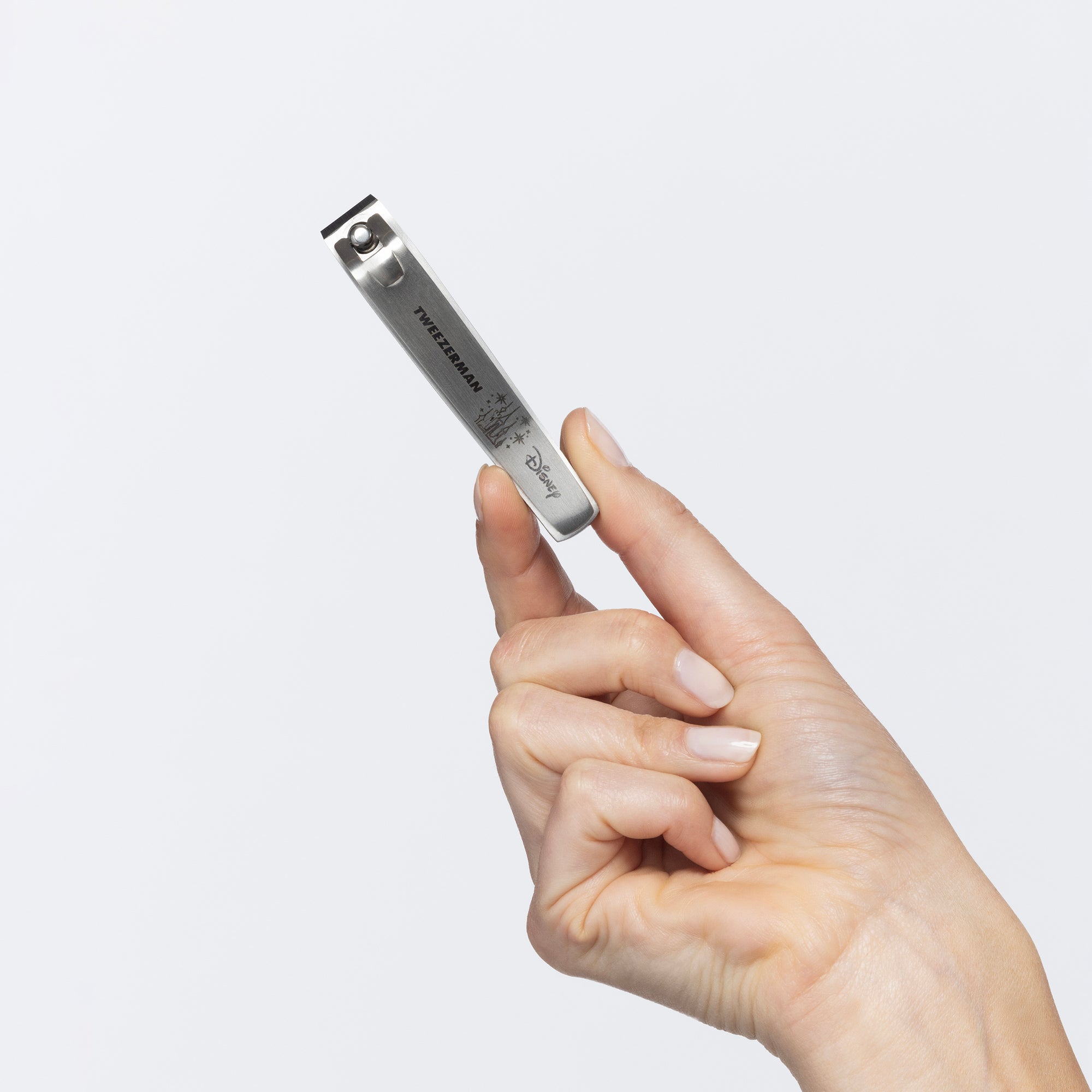 Model holding Disney&#39;s Happily Toenail Clipper