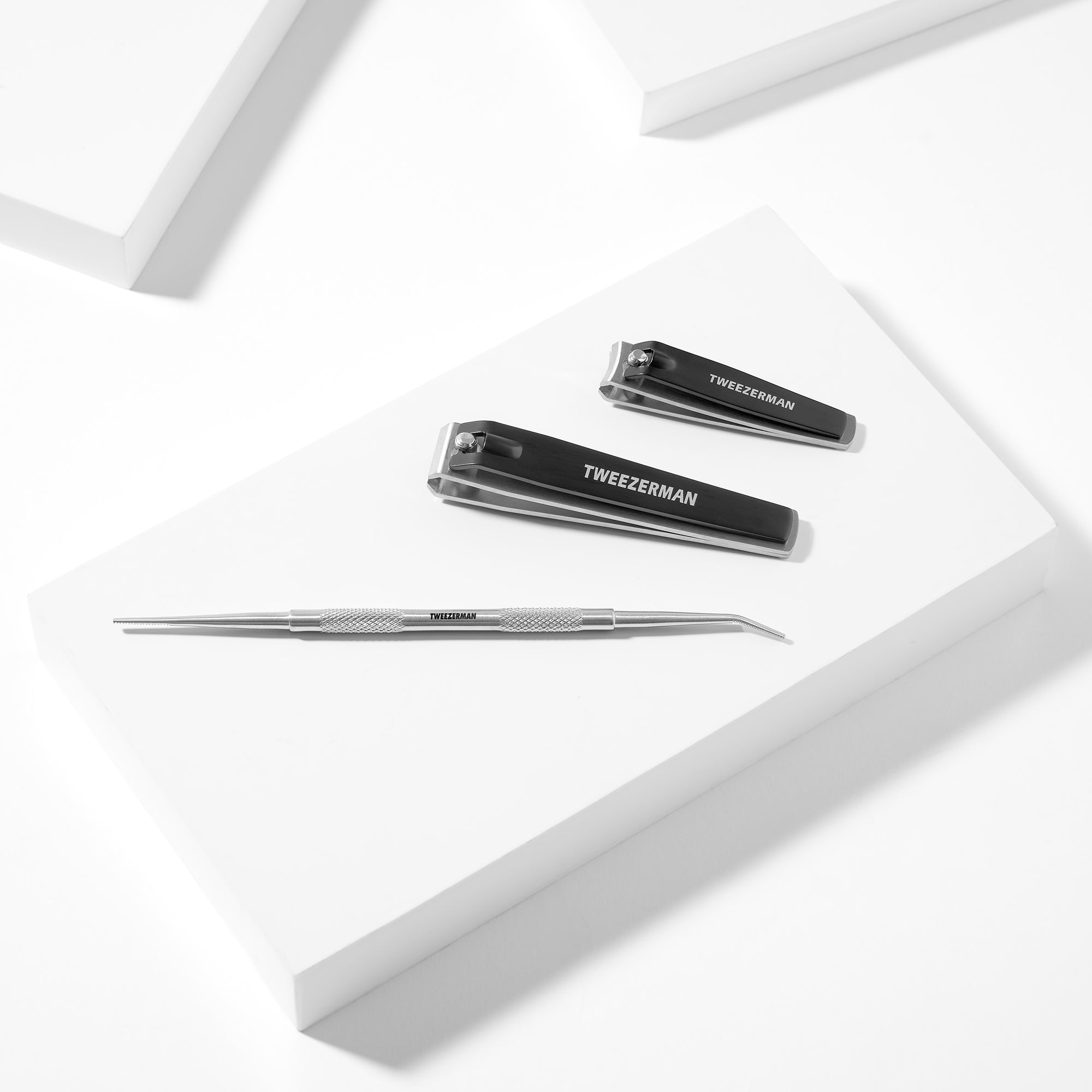 Combo Clipper and Ingrown File placed on a white block tray