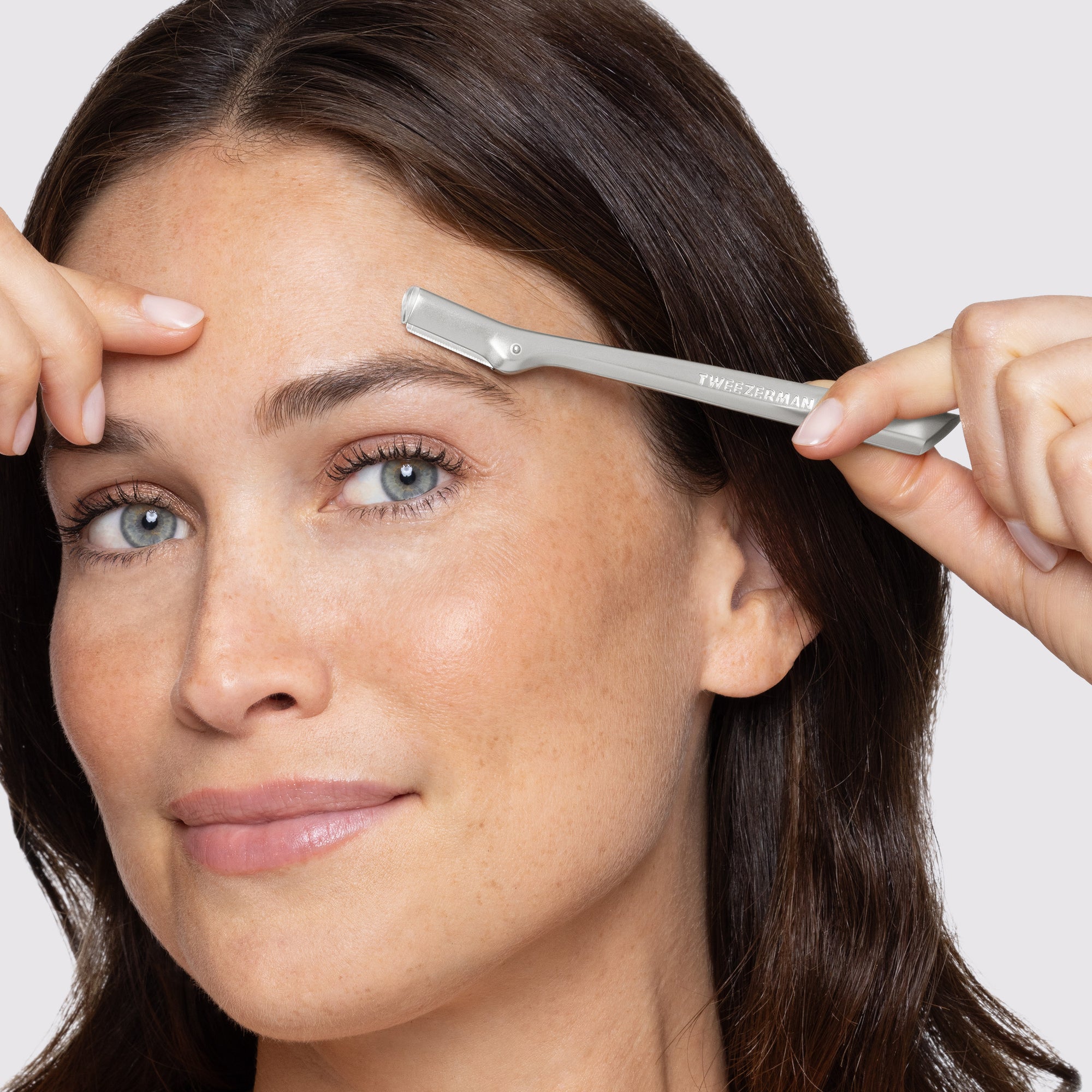 Model using Brow Razor on brows