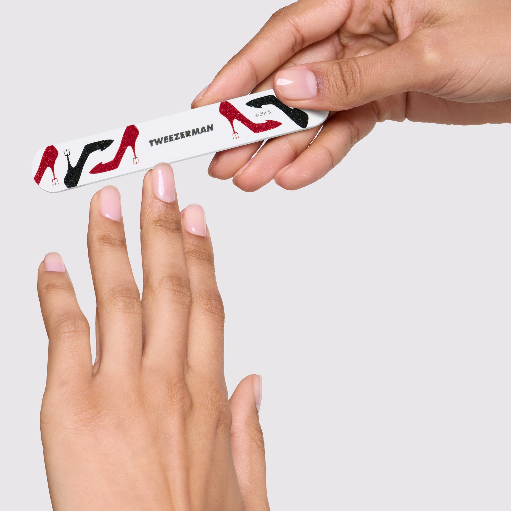 Model filing her nails with The Devil Wears Prada 2 Nail File