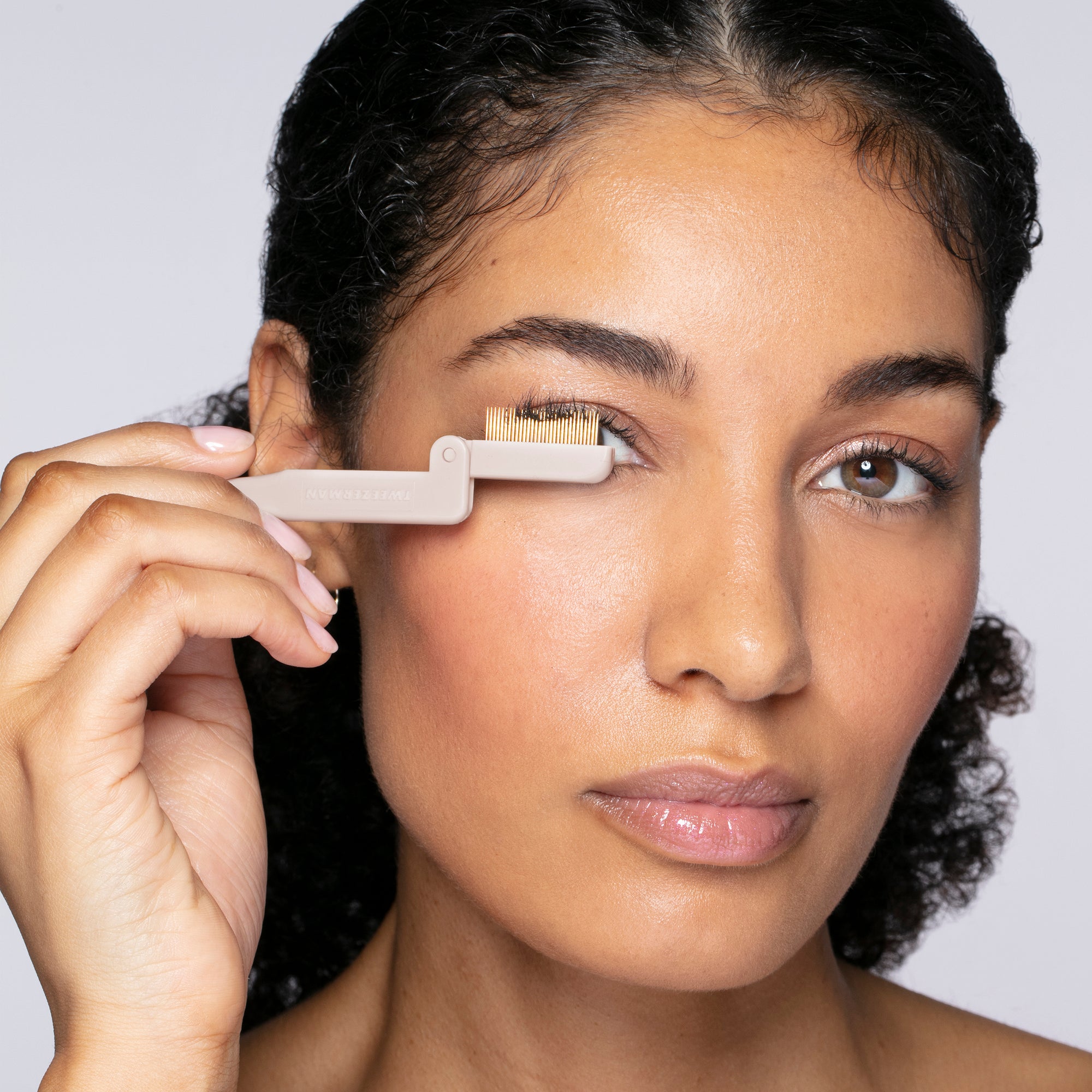 Model using Limited edition Gold ilashcomb