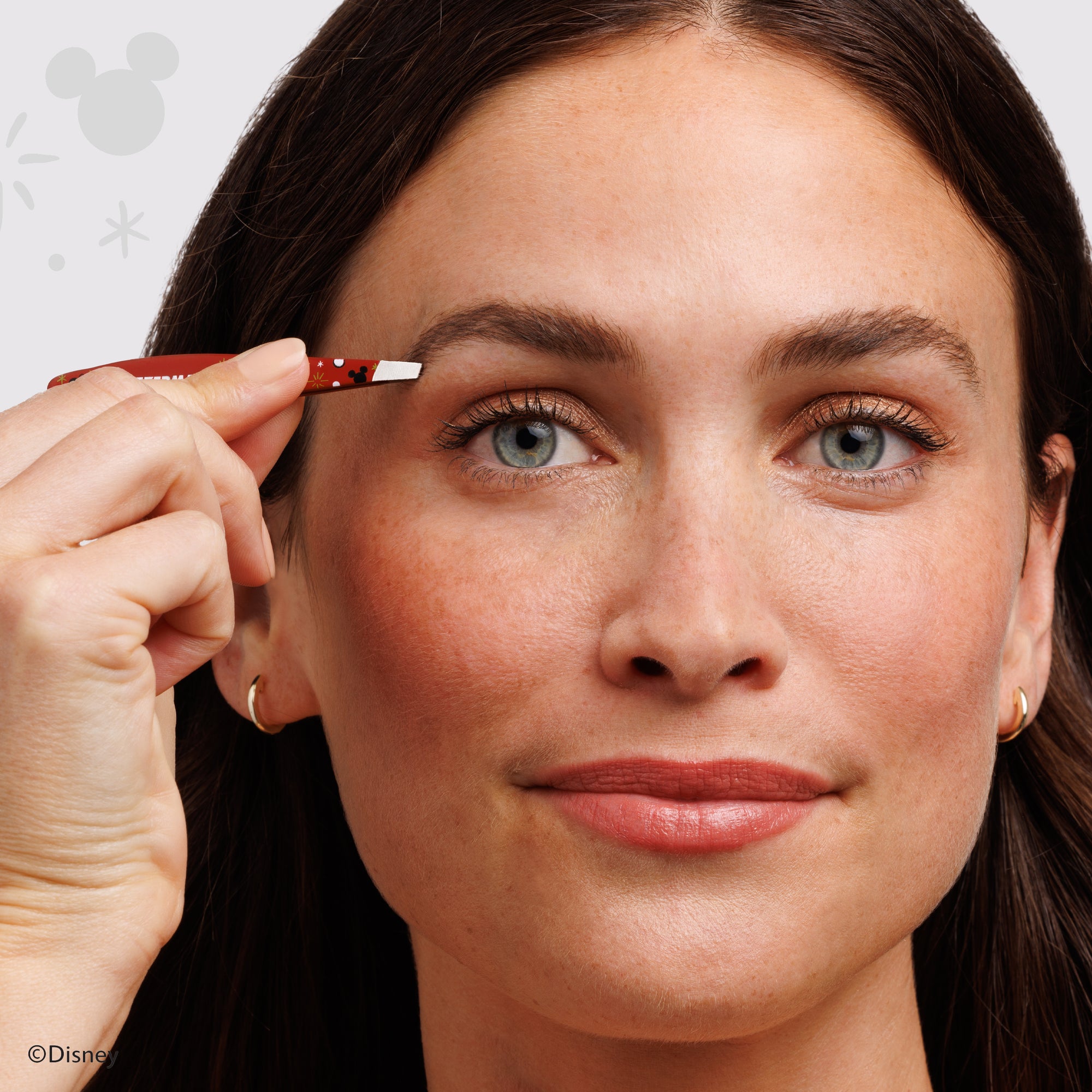 Model using Disney&#39;s Mickey Mouse &amp; Minnie Mouse Magic All Around Mini Slant Tweezer