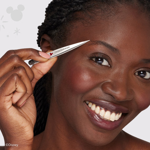 Model using Stainless steel petite point tweezer with red writing with Mickey and Minnie Mouse