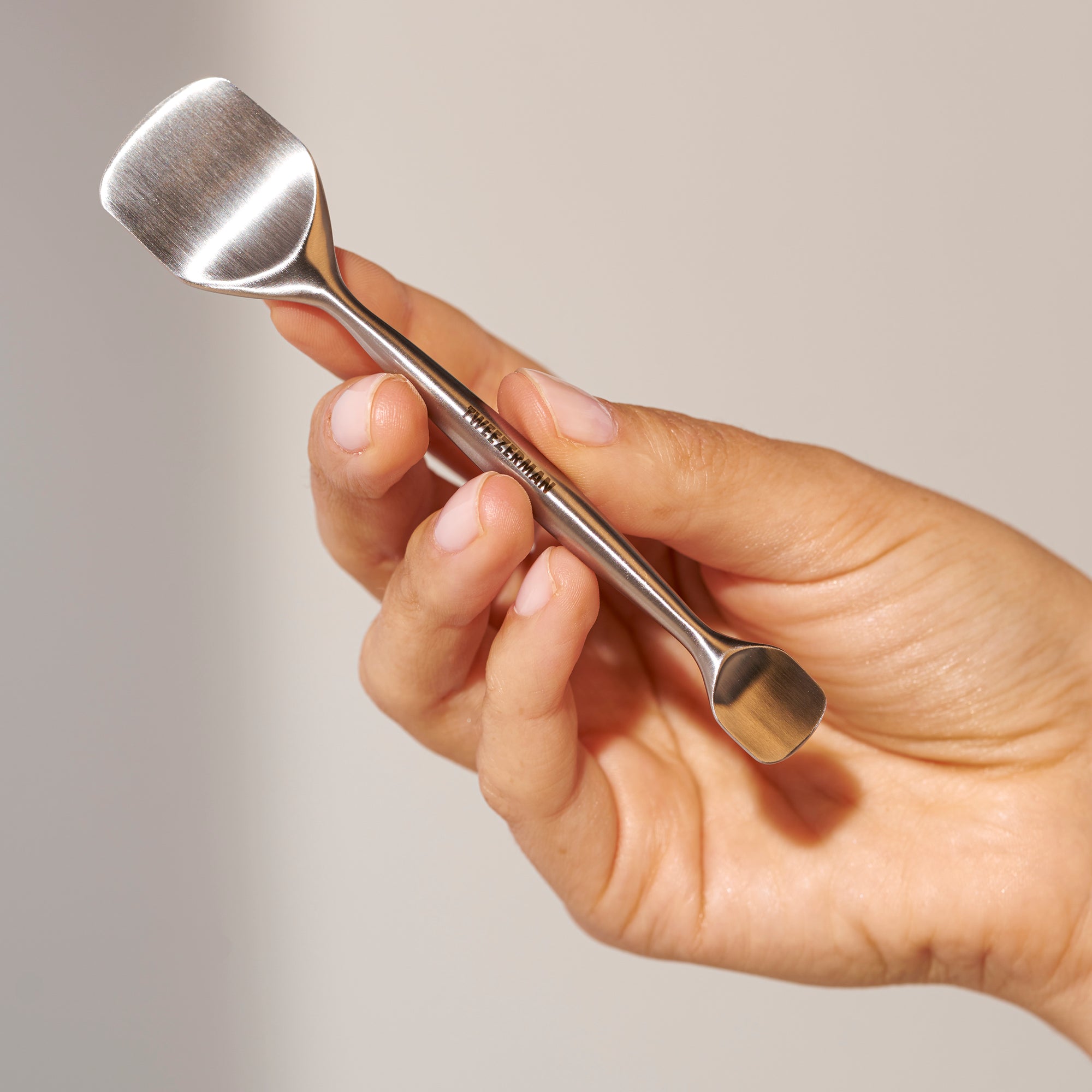 Female Model holding pore prep tool
