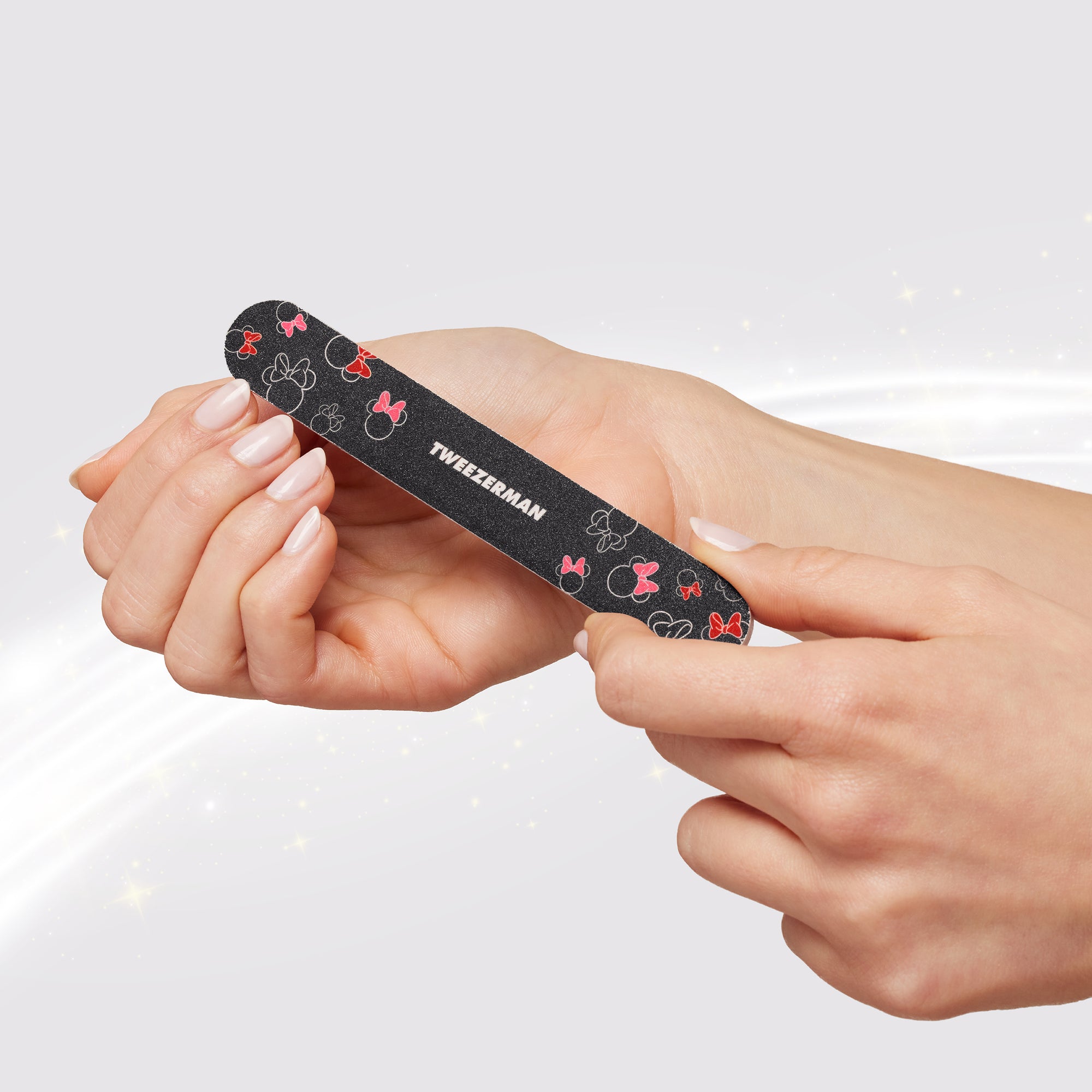 Model using black Mickey and Minnie Mouse Nail File
