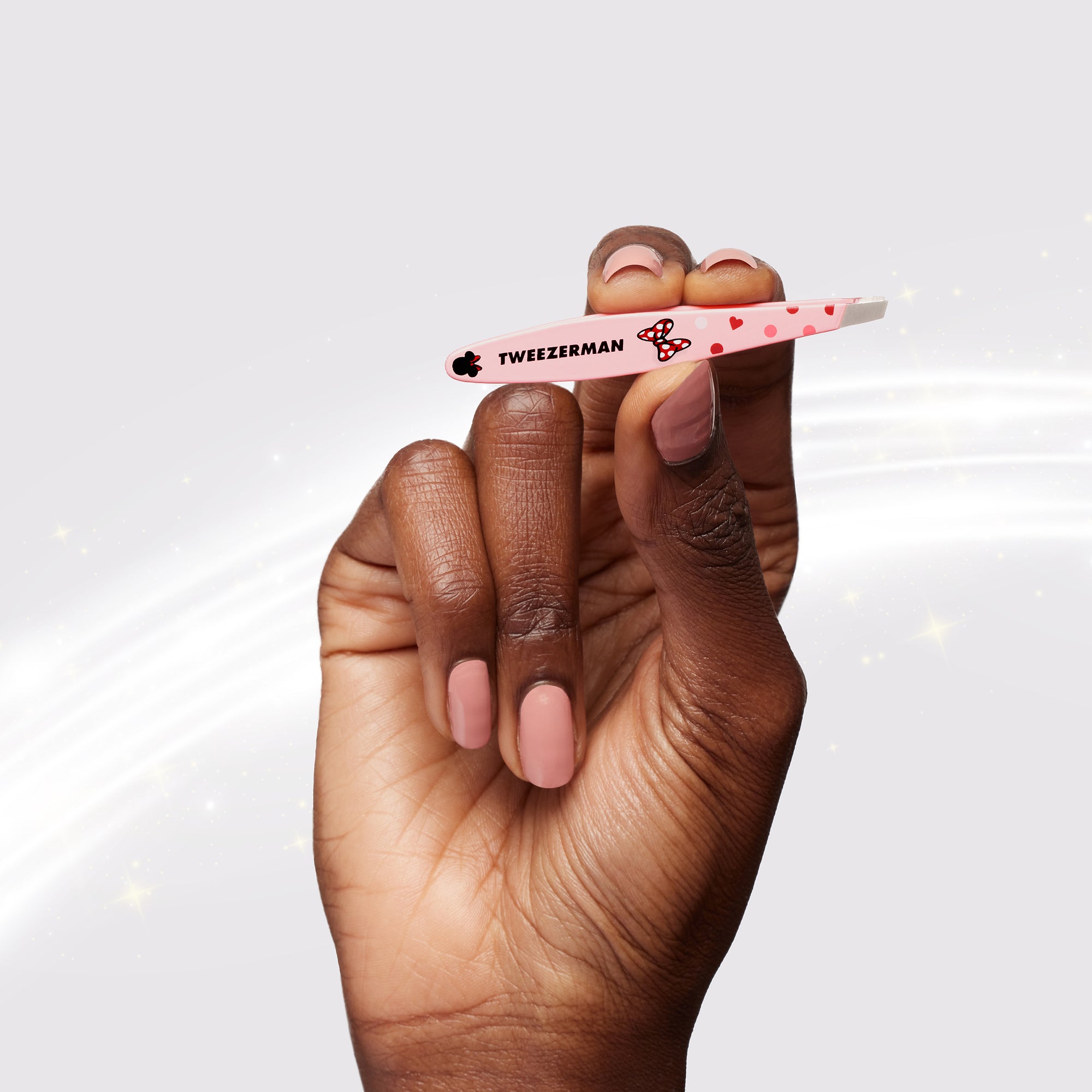 Model Holding Bowtiful Brows Mini Slant Tweezer
