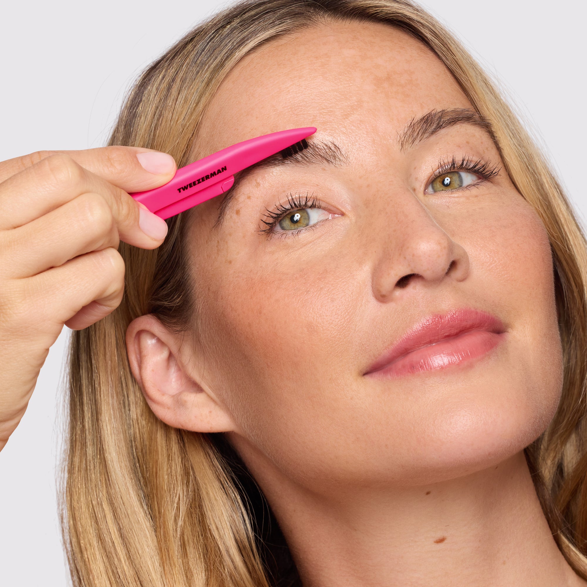 Model using brush side of Pink Dual-sided Precision Folding Razor