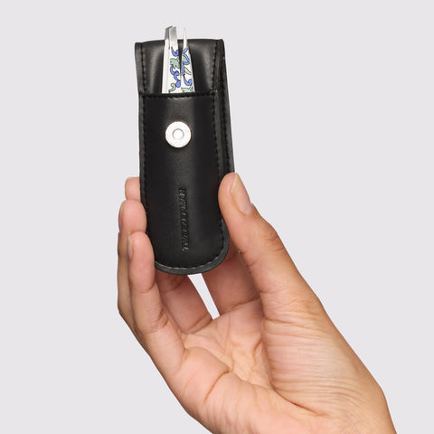 Female Model holding the Paisley Petite Tweezer Set, point tweezer and slant tweezer with black case