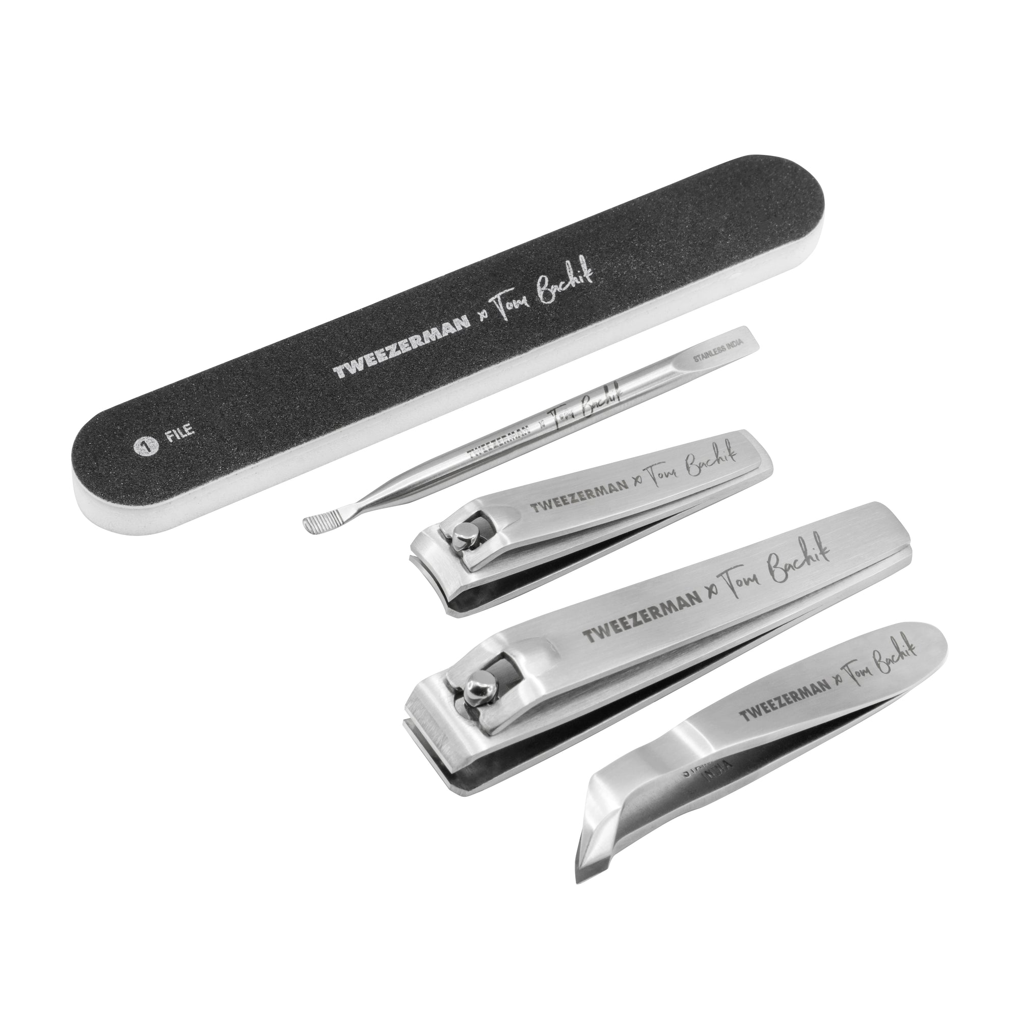 Dual sided nail file with black color finish and lettering in white color &quot;(1) File Tweezerman x Tom Bachik&quot;
Mini nail pushy and cleaner with stainless steel finish and dark grey color lettering &quot;Tweezerman x Tom Bachik&quot;
Stainless steel fingernail clipper with dark grey color lettering &quot;Tweezerman x Tom Bachik&quot;
Stainless steel toenail clipper with dark grey color lettering &quot;Tweezerman x Tom Bachik&quot;
Mini cuticle nipper with stainless steel finish and dark grey color lettering &quot;Tweezerman x Tom Bachik&quot;