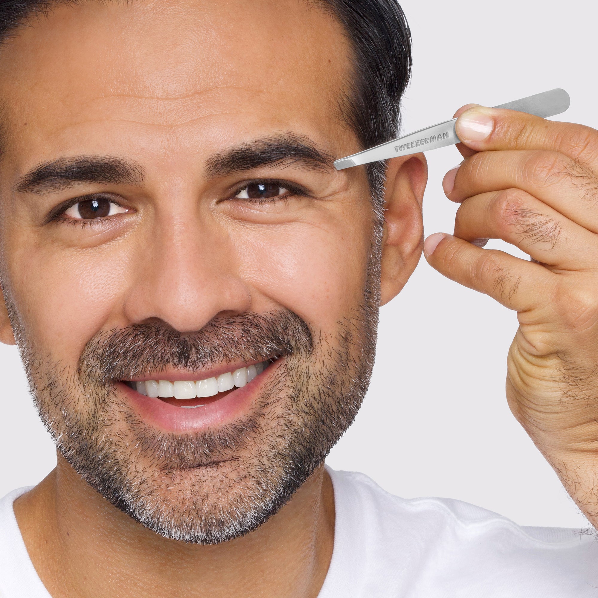 Male Model using Classic Stainless Steel Slant Tweezer on brows