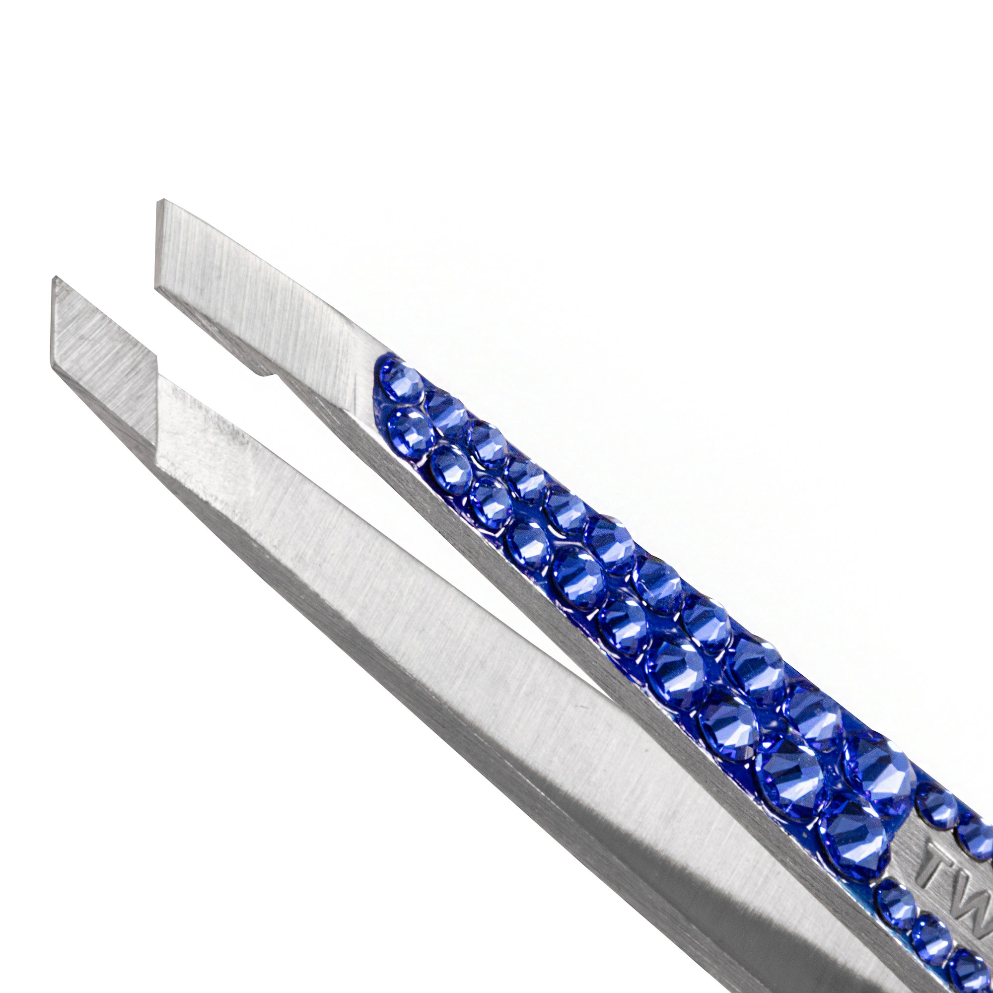 Tweezerman  special edition Blue Sapphire Swarovski Crystal Tweezer with stainless steel slant tips. 