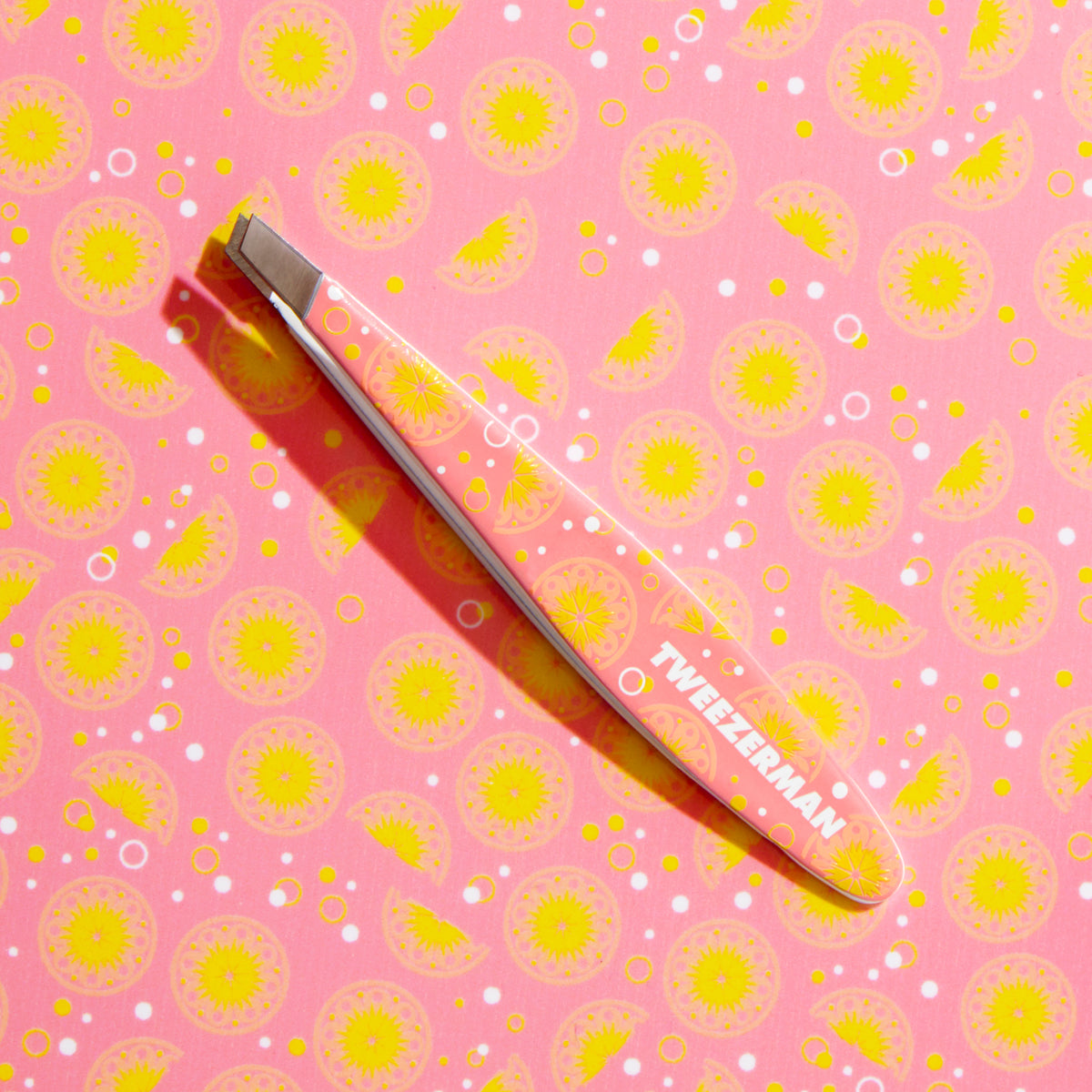 Stainless Steel Pink Lemonade Mini Slant Tweezer featured with Pink Lemonade Background