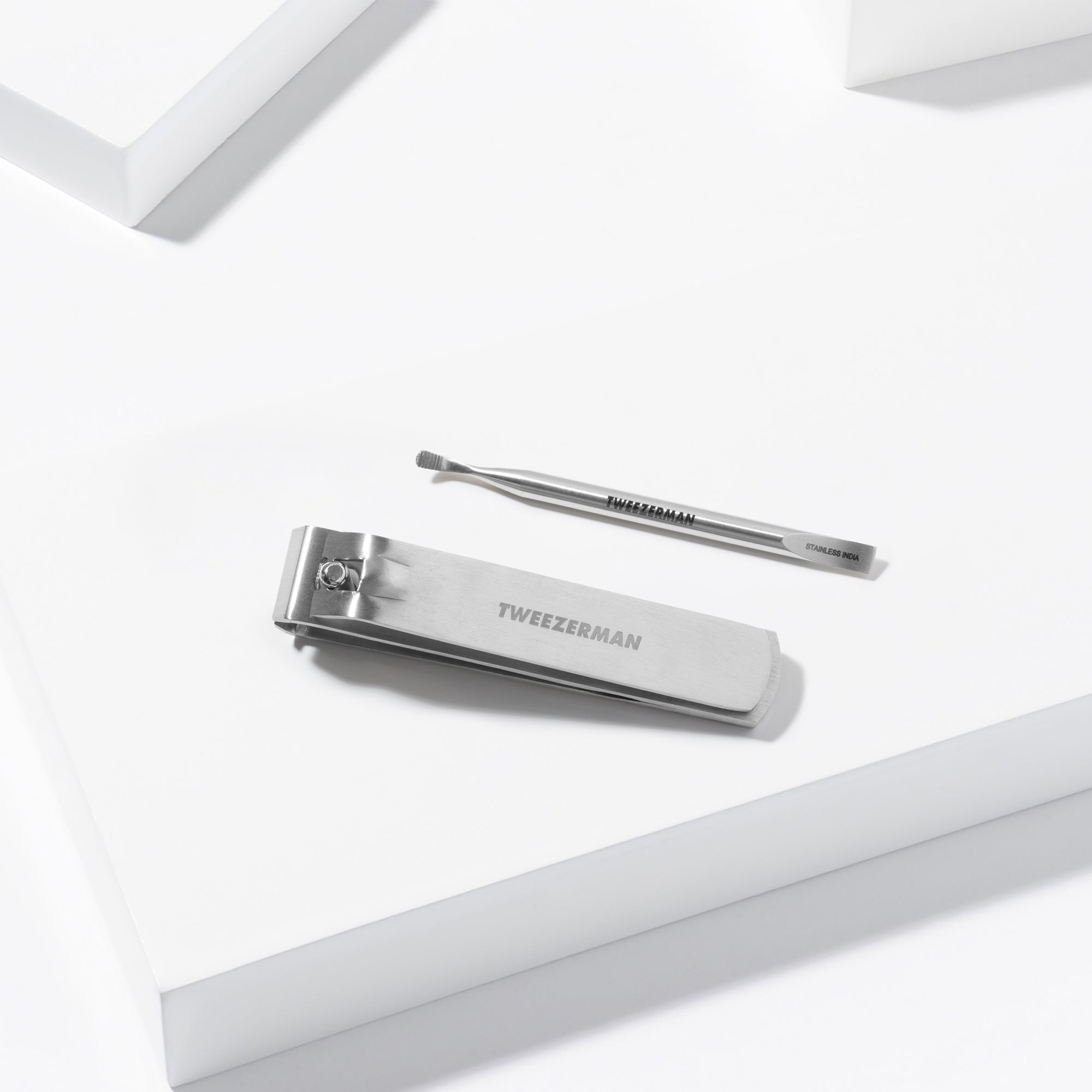 Extra Strength Toenail Clipper and Mini Cuticle Pushy &amp; Cleaner with Ridges placed on a white background