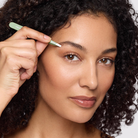 Model holding and using Pistachio Full Slant Tweezer