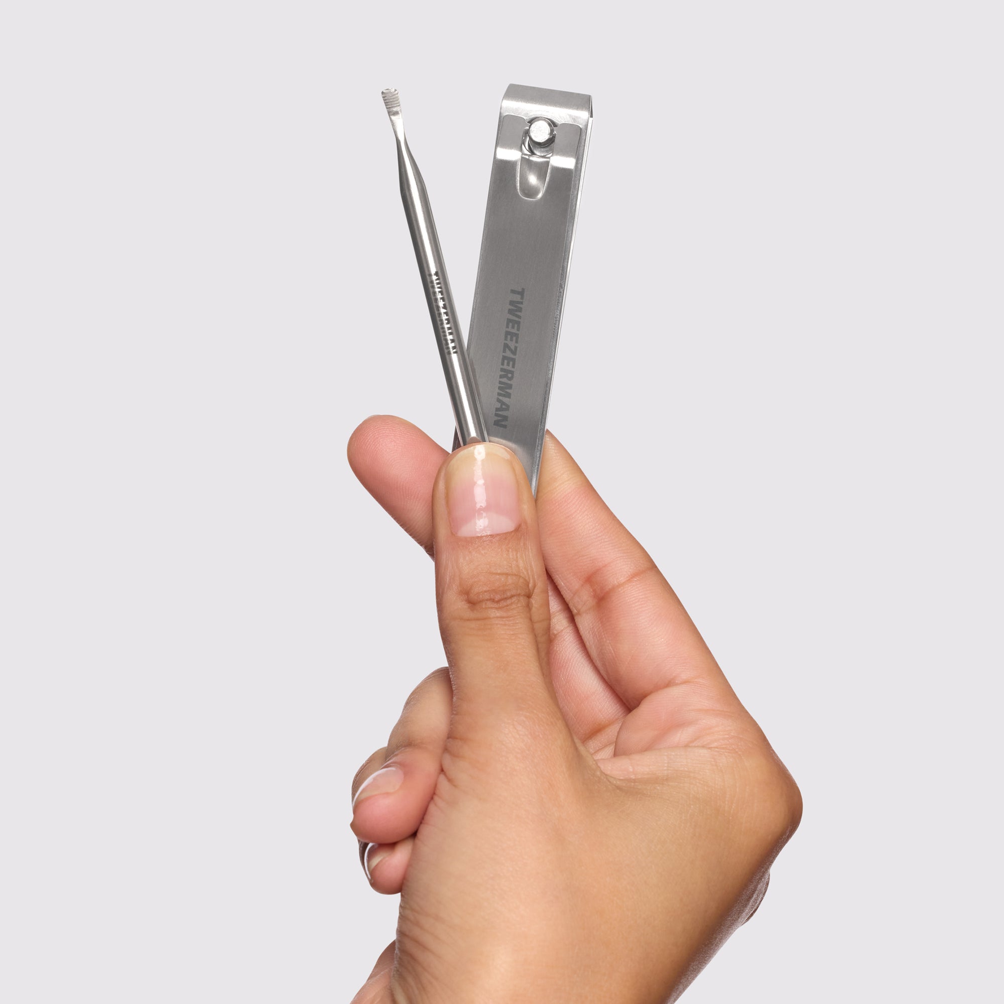 Model holding Extra Strength Nailcare Kit