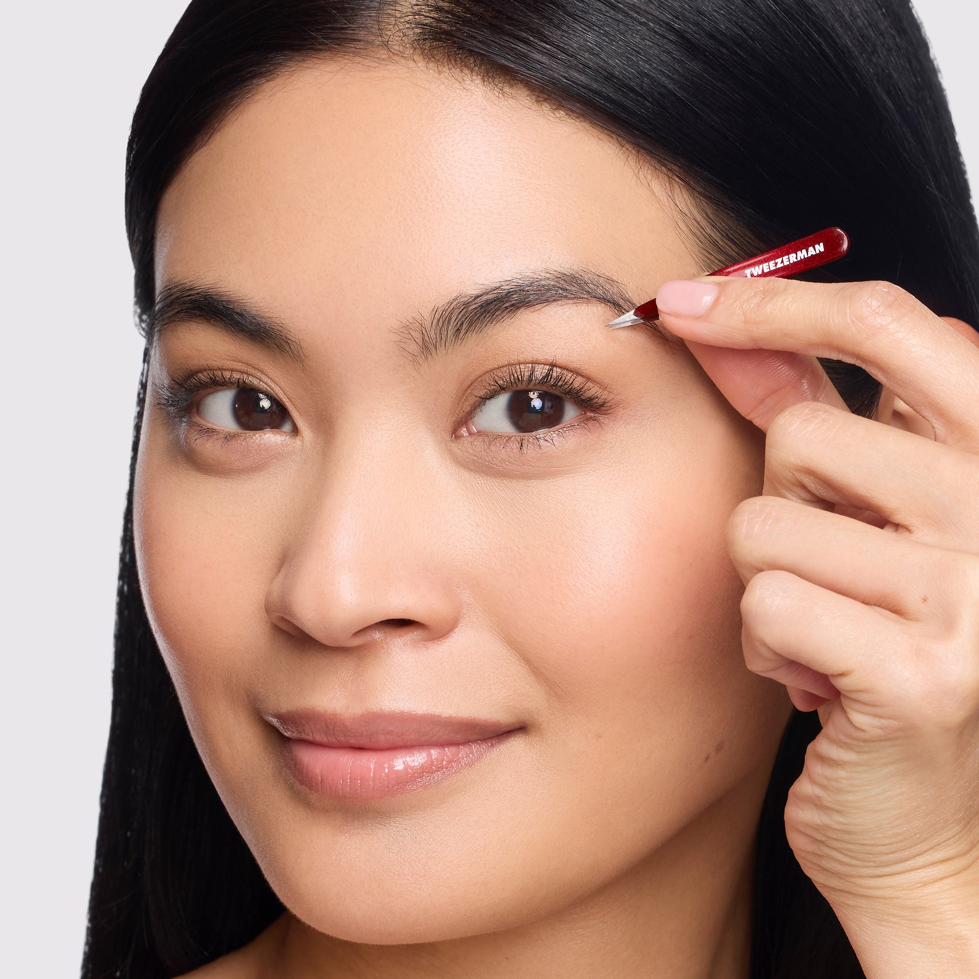 Model holding Vintage Rose Micro Mini Point Tweezer