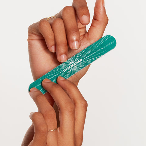 Model using Emerald Green Shimmer dual-sided nail file