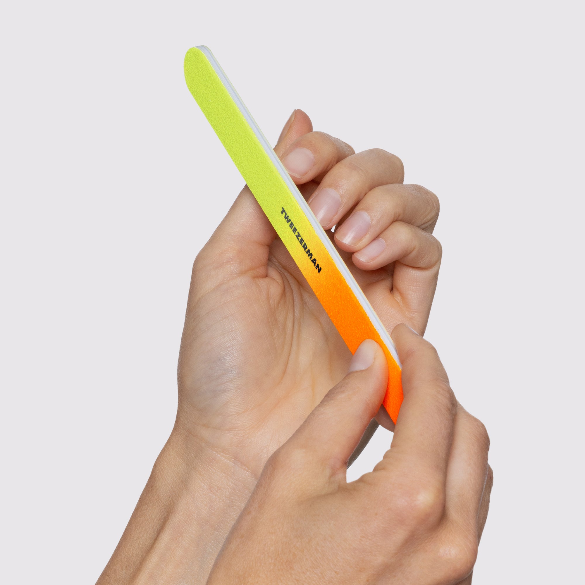 MODEL USING Neon Nail Kit&#39;s Neon File Set and filing fingernails