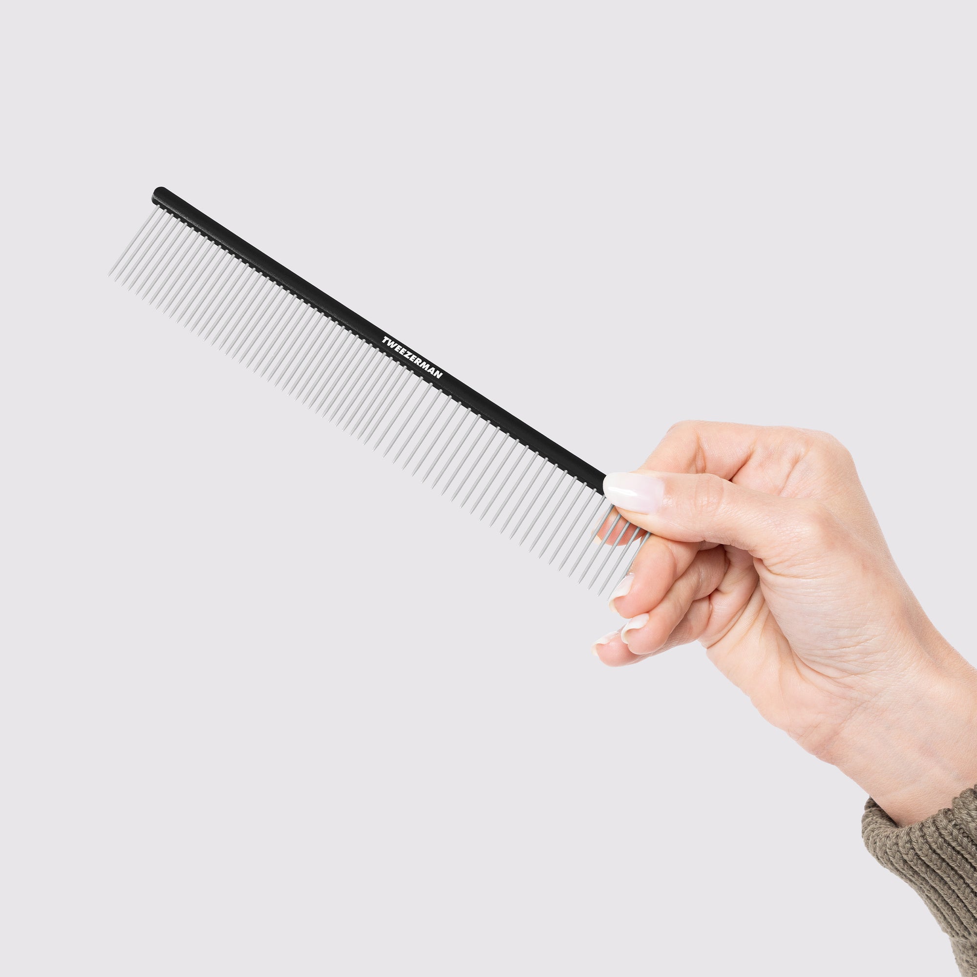 Model holding Dual-Sided Detangling Comb